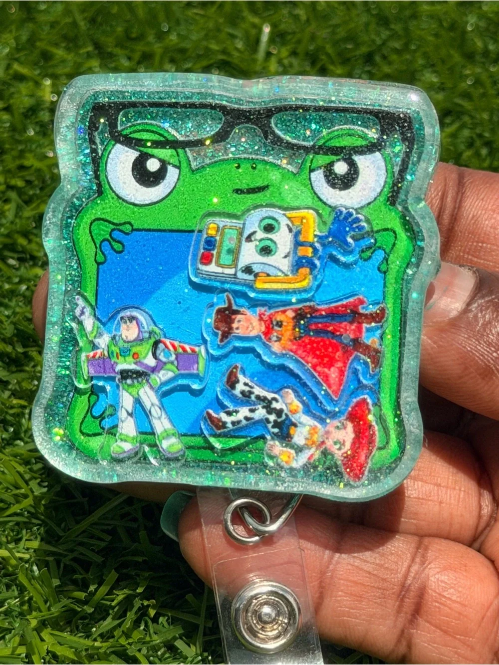 Green Frog Badge Reel with Colorful Toy Story Decals